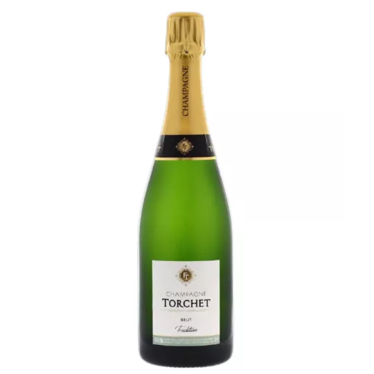 Flasche Champagne LAËTITIA TORCHET Brut Tradition wird serviert.