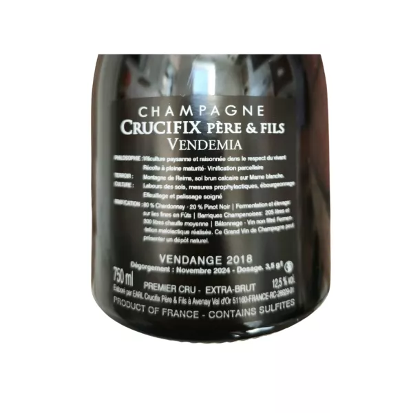 Gegenetikett Champagnerflasche Crucifix Vendemia Extra-Brut Premier Cru, 80 % Chardonnay, 60 Monate Reifung.